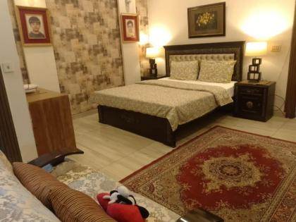 MJS Entire New Designer House 5 BR 13 bed 2 living reclining sofas Italian kitchen 6 bath garage side garden at prime location of Bahria Town Islamabad - image 22