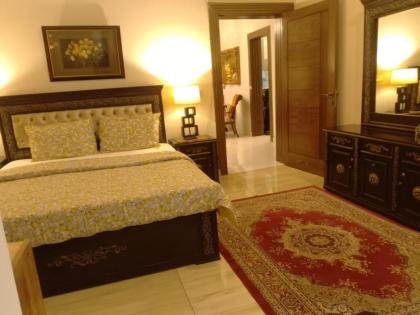 MJS Entire New Designer House 5 BR 13 bed 2 living reclining sofas Italian kitchen 6 bath garage side garden at prime location of Bahria Town Islamabad - image 23
